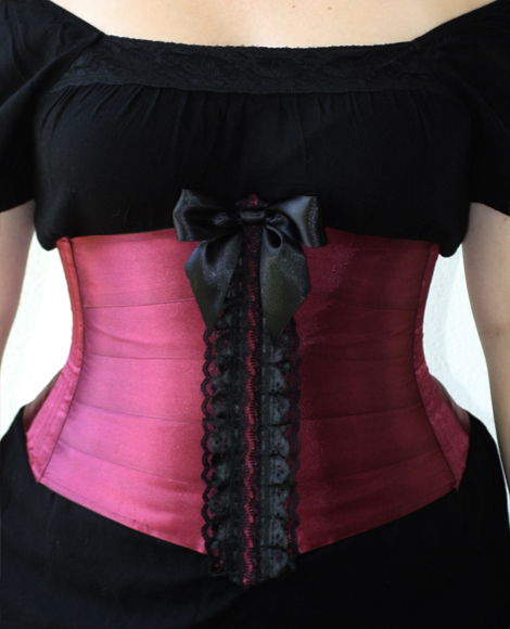 Purple satin ribbon corset with black lace trimmings.